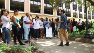LSU Ph.D. Student Joseph Coco, an organizer for the LSU sign making and information meeting, addresses the crowd